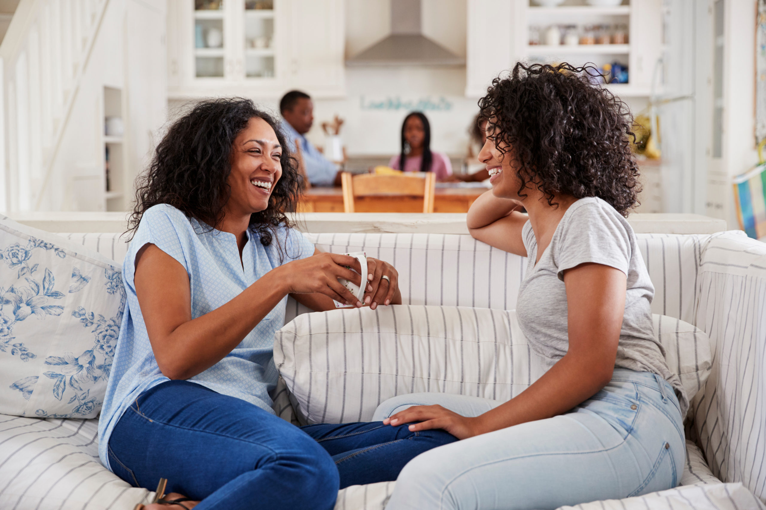 Mother Talking With Teenage Daughter On Sofa, Protecting Your Child's Critical Thinking in the AI Age