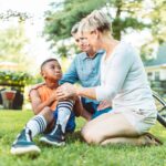 Parents soothing a child who fell off his bike, Understand and Support Your Neurodivergent Child: From Misbehavior to Stress Response