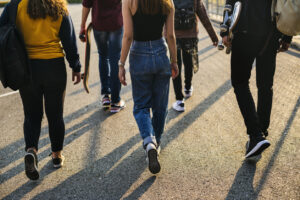 Teens walking backs to camera