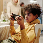 How to Set Tech Boundaries Without Losing Your Child’s Trust: A Parent’s Guide to Screen Time, Group Chats, and Social Media